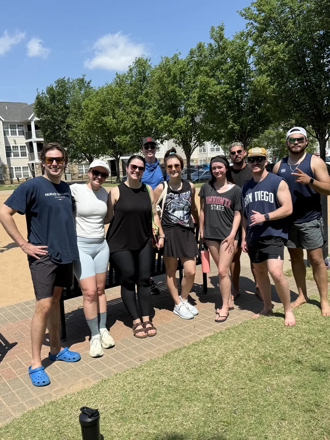 A group of Sandline players together beside the courts